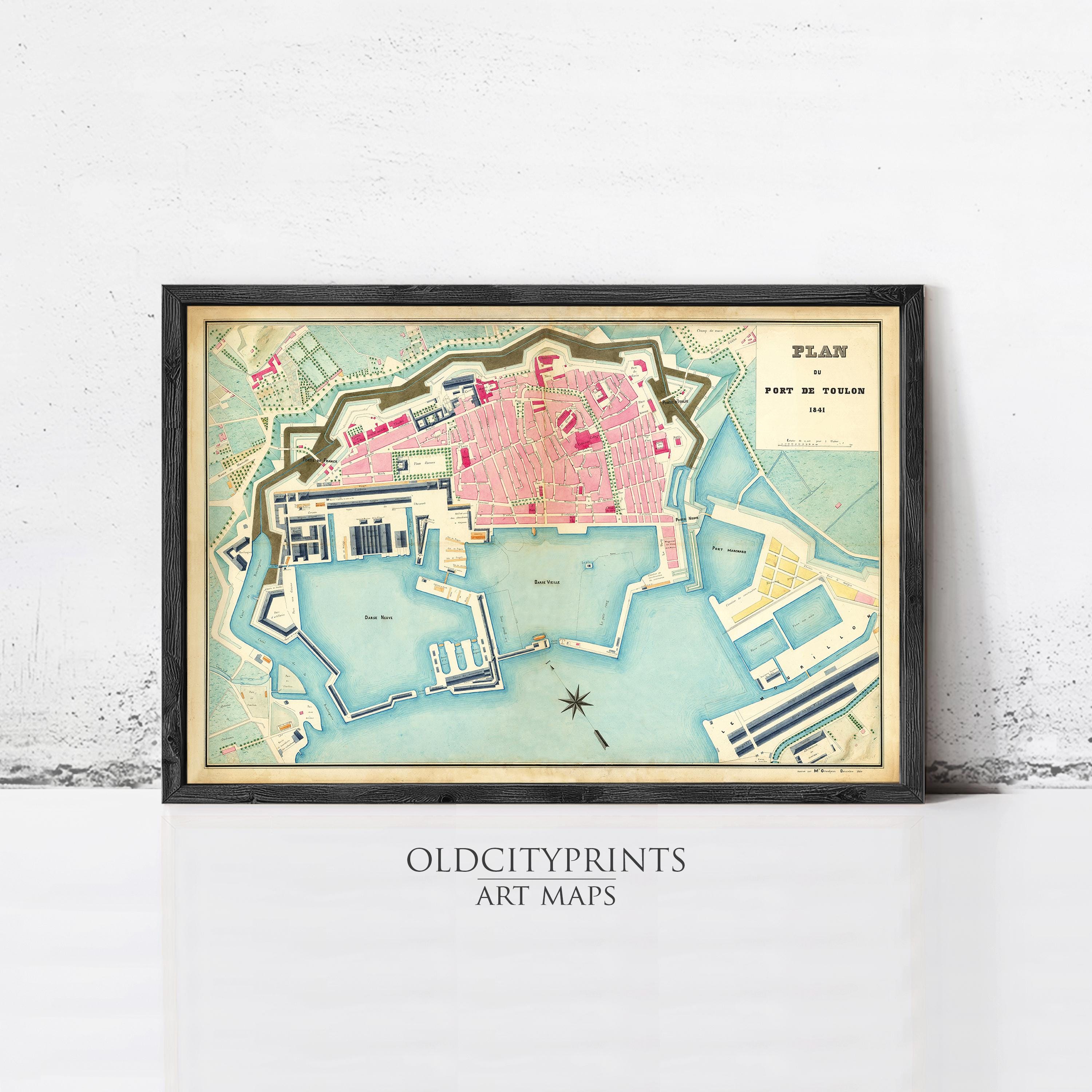 The image is a framed vintage map of a city, likely from the 19th century, depicting a coastal area with a harbor and surrounding land.