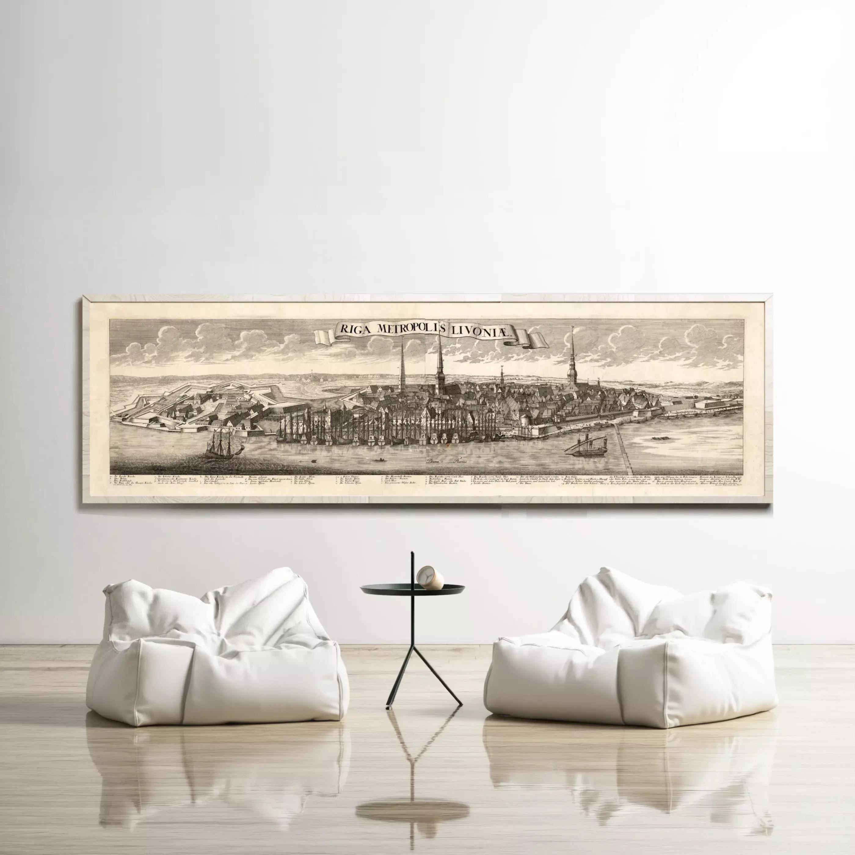 a large framed map of a city, with two white bean bag chairs positioned in front of it, creating a cozy seating area.