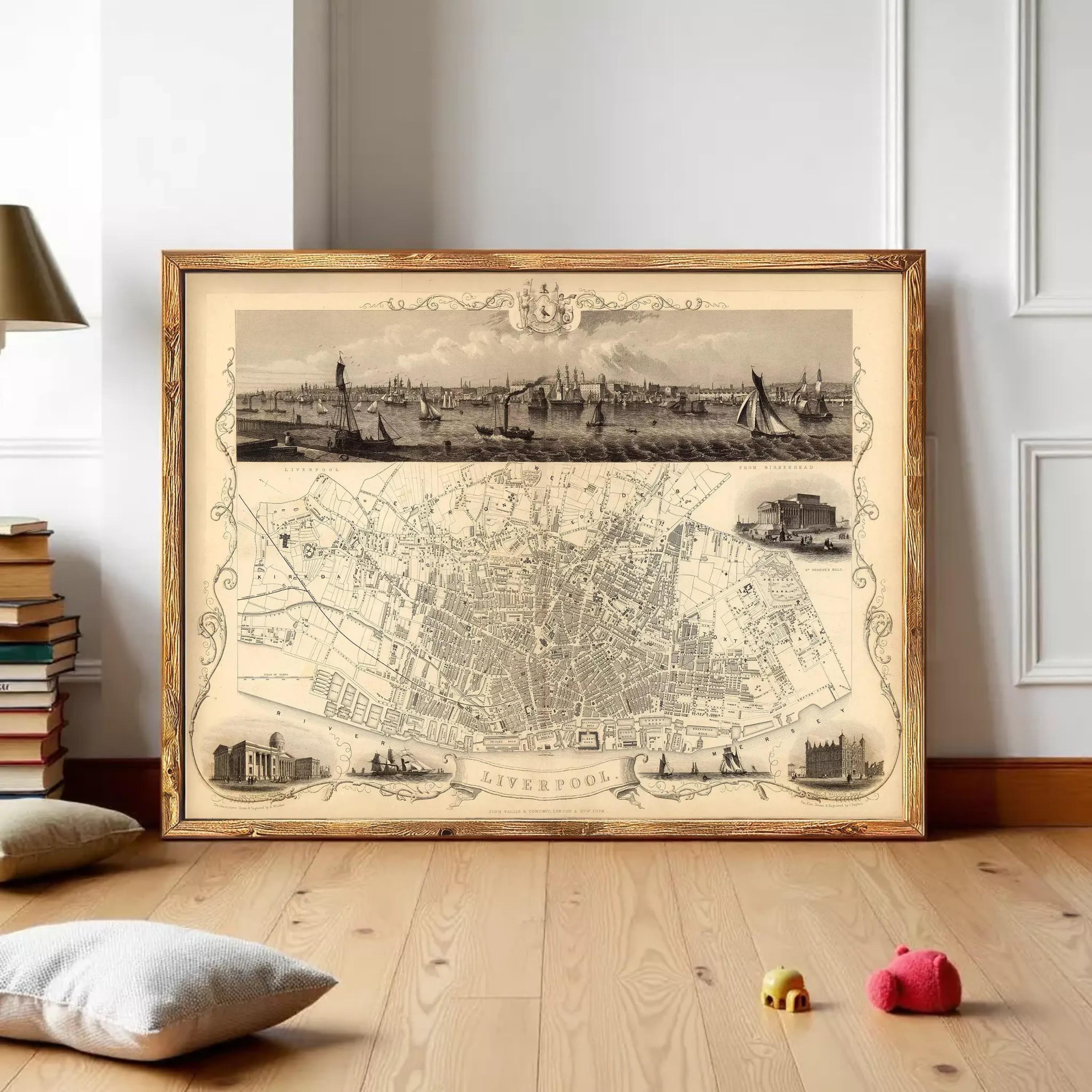 a large framed map of Liverpool, with a detailed illustration of the city's streets and landmarks. The map is displayed on a wooden floor, and there are some books and toys in the foreground.