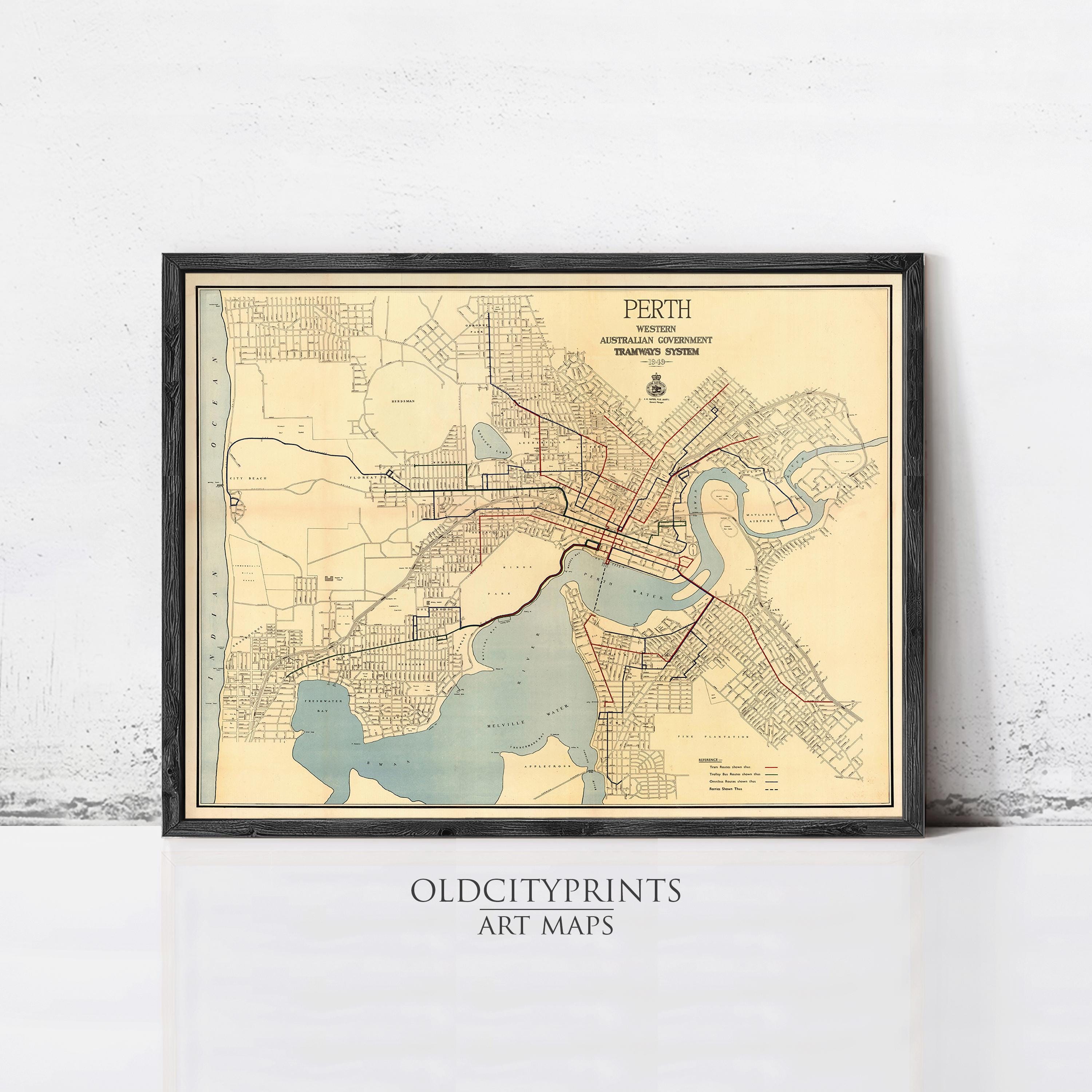 The image is a framed vintage map of the city of Perth, Australia, depicting the city's streets, waterways, and surrounding areas.