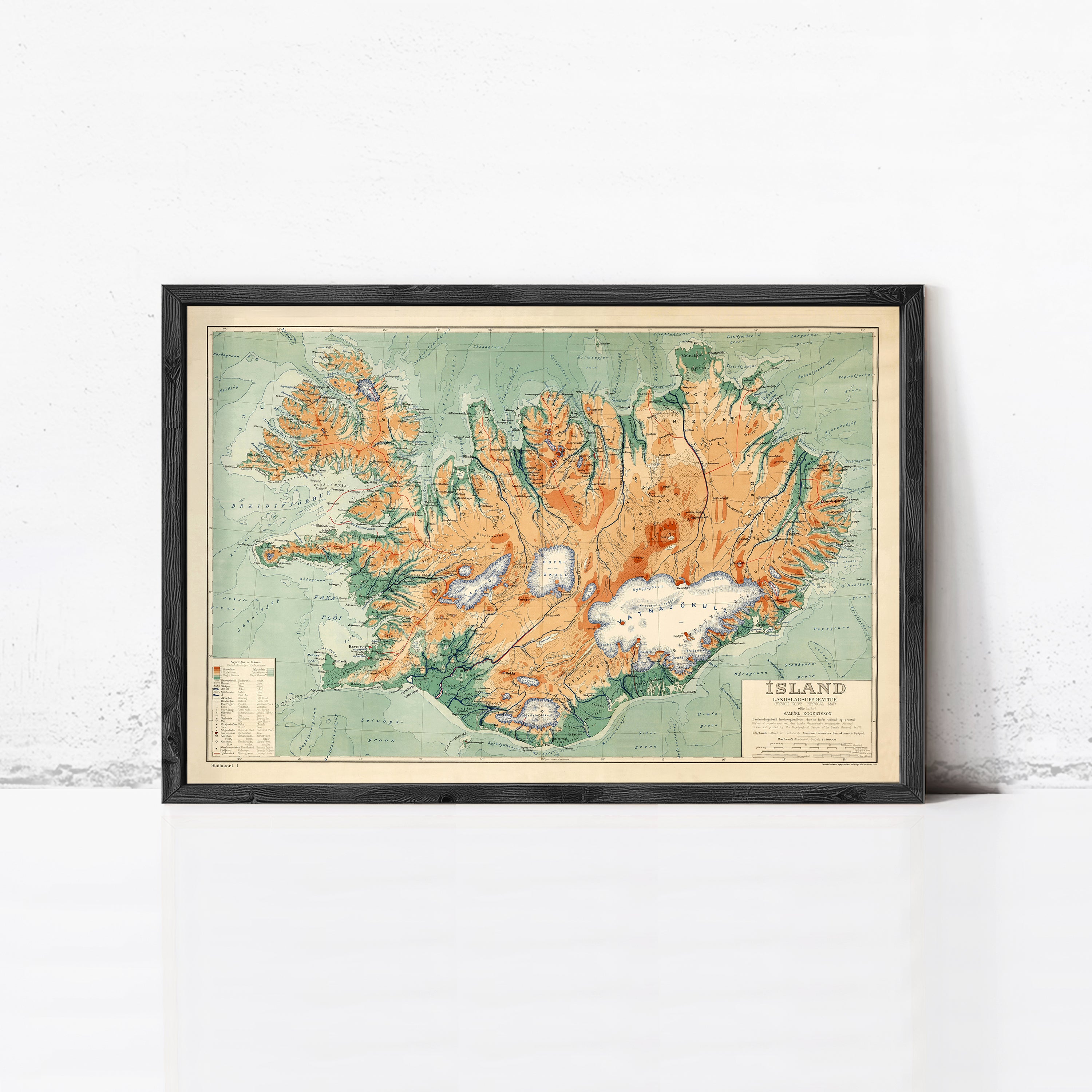 The image is a framed map of Iceland, depicting the country's geographical features and boundaries.