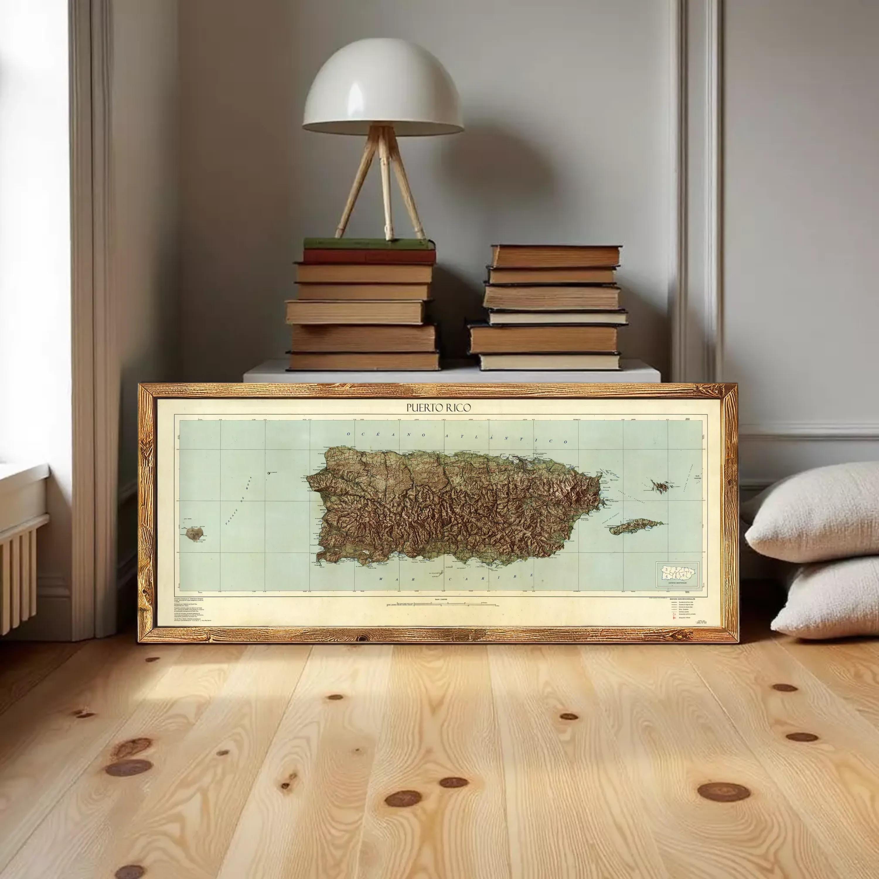 A framed map of Puerto Rico is displayed against a white wall.