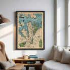 a large framed map of a city hanging on a wall in a living room.