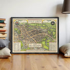 The image is a framed vintage map of Oxford, England, depicting the city's layout and surrounding areas.