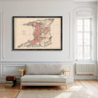 a large framed map of Trinidad and Tobago hanging on a white wall in a living room.