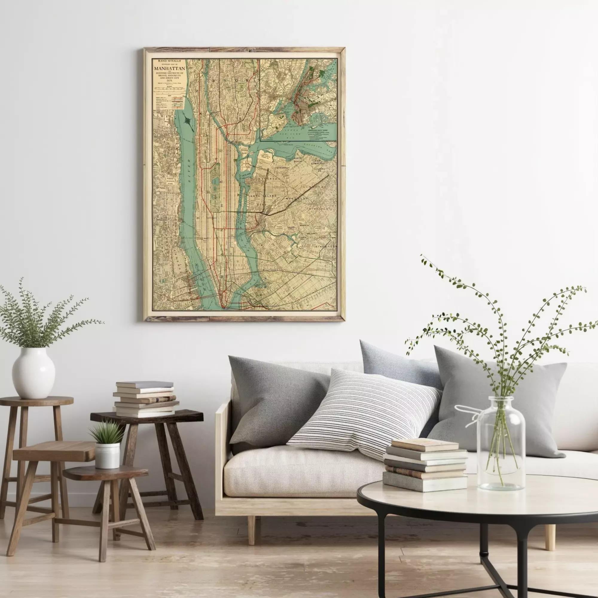 a living room with a large framed map of New York City hanging on the wall above a couch with pillows and a coffee table.
