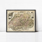 The image is a framed antique map of Europe, depicting various countries and regions in a detailed and intricate manner.