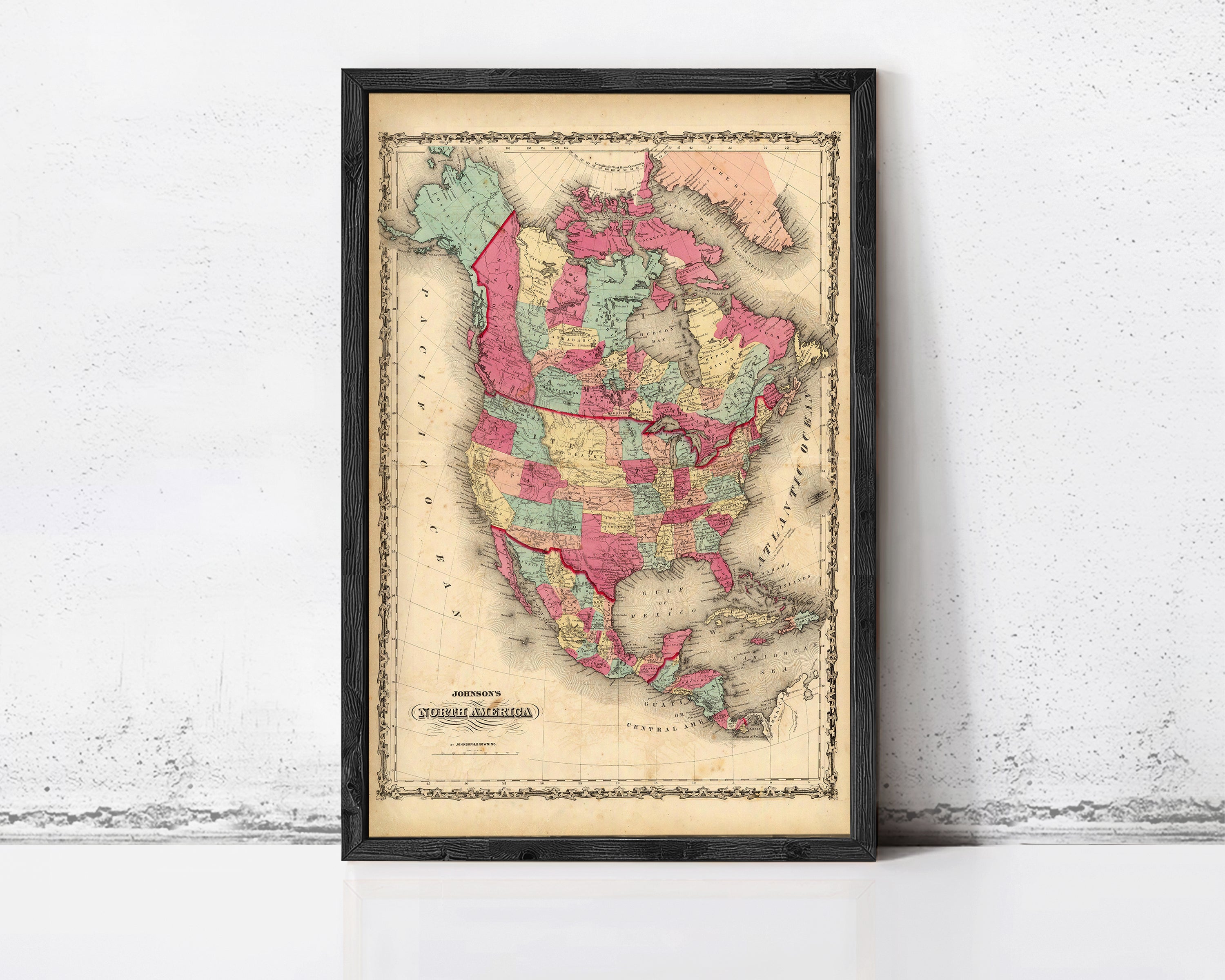 The image is a framed vintage map of North America, depicting the United States and Canada.
