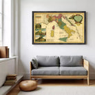 a large framed map of Europe hanging on a wall above a gray sofa in a living room.