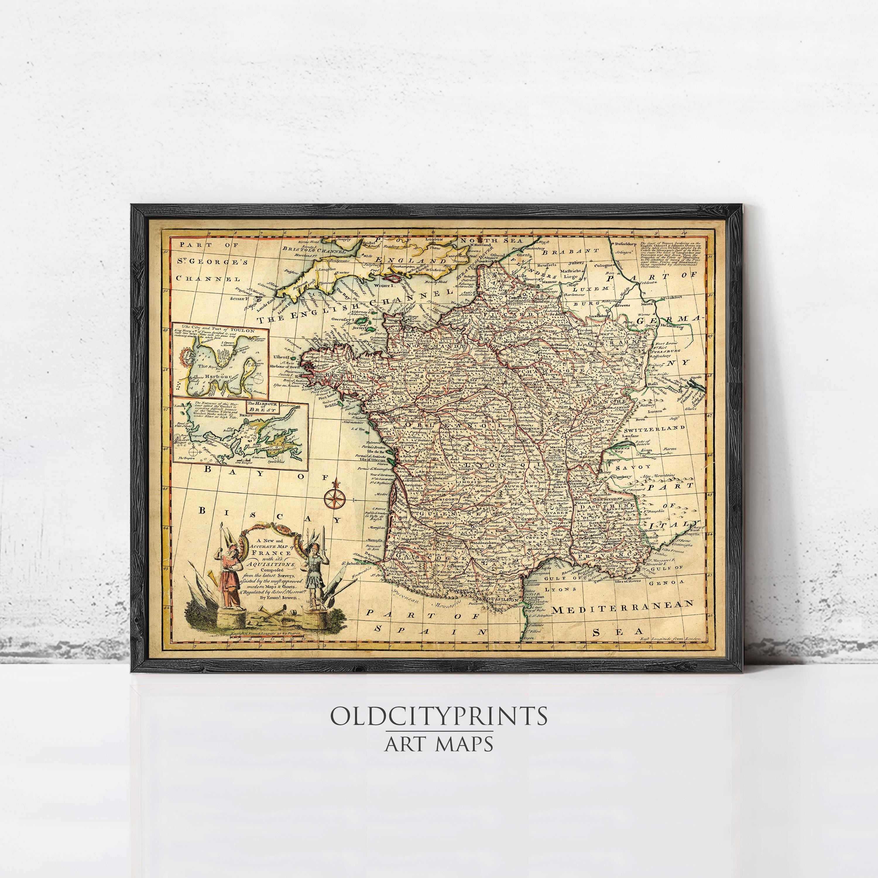 The image is a framed vintage map of France, depicting the country's geographical layout and surrounding regions.