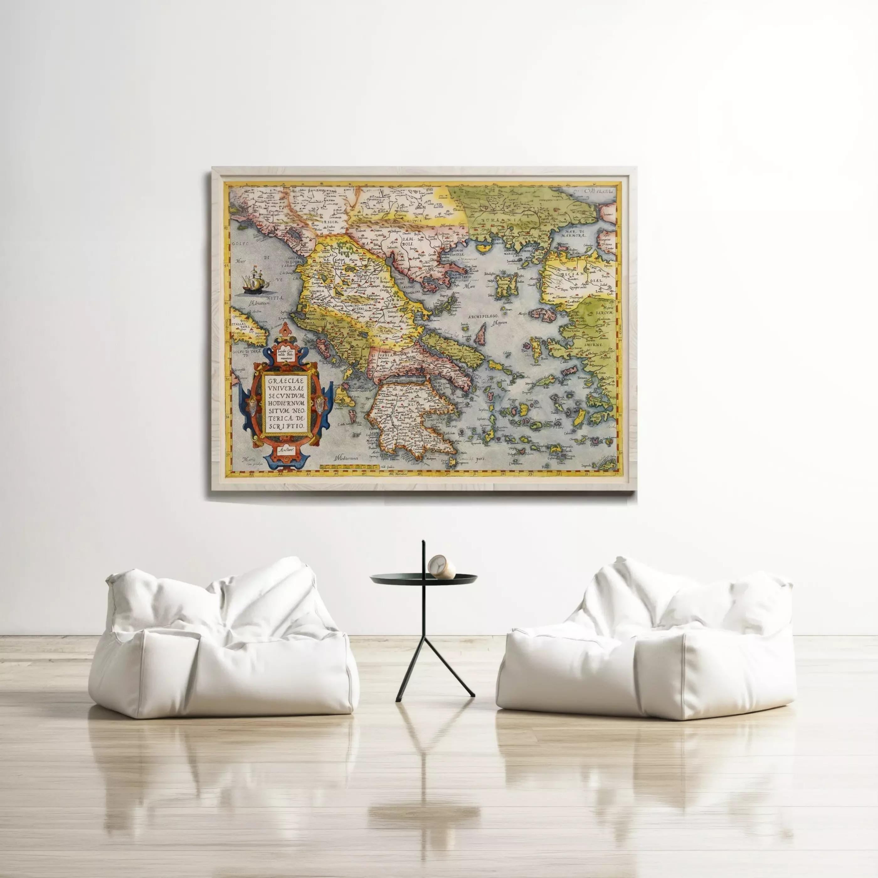 a large, colorful map of the world hanging on a white wall, with two white bean bag chairs positioned in front of it.