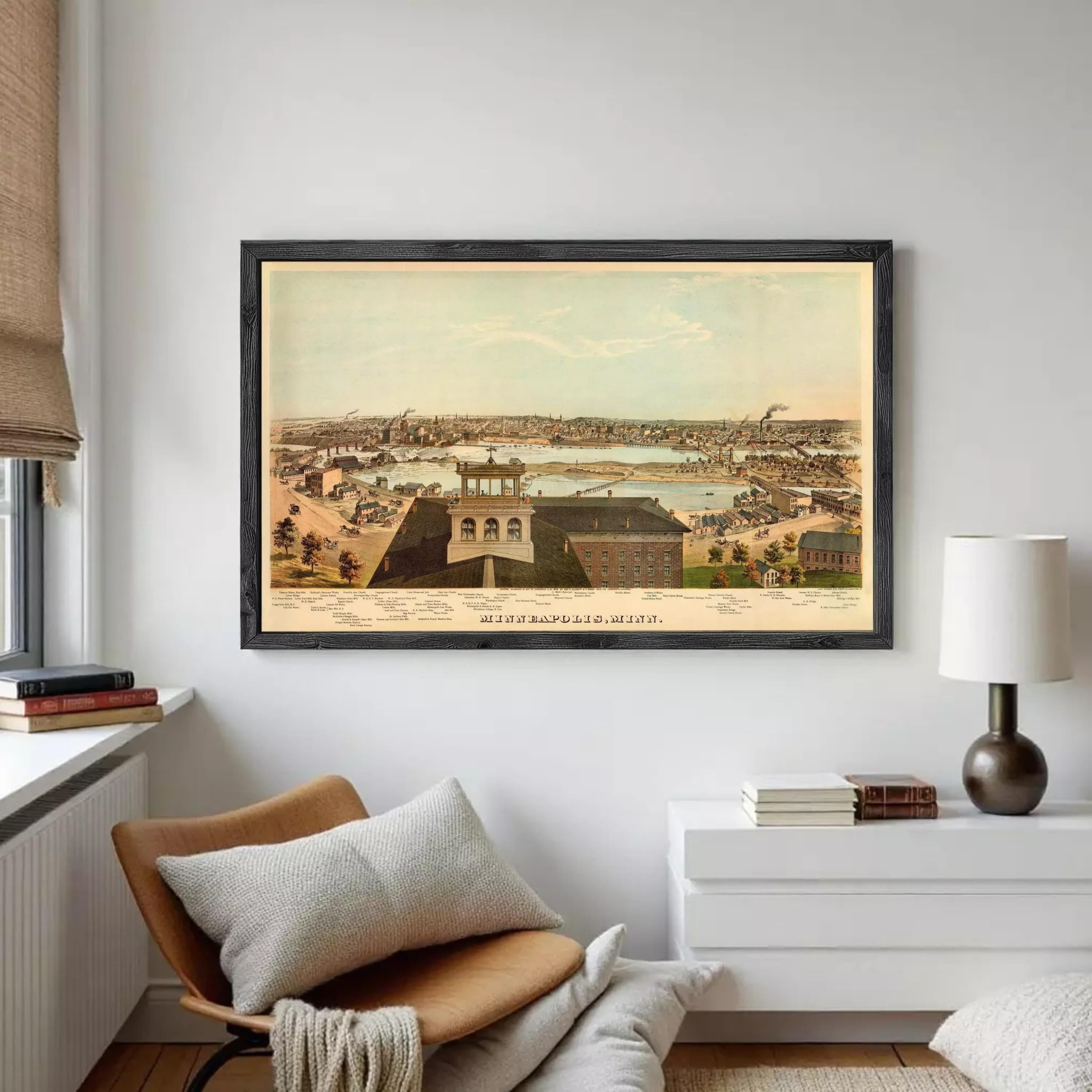 The image is a framed vintage map of Minneapolis, Minnesota, depicting the city's skyline and surrounding areas.
