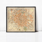 The image is a framed vintage map of the city of Bologna, Italy, depicting the streets, landmarks, and surrounding areas.