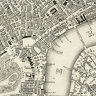 The image is a detailed black and white map of a city, showing streets, buildings, and landmarks.