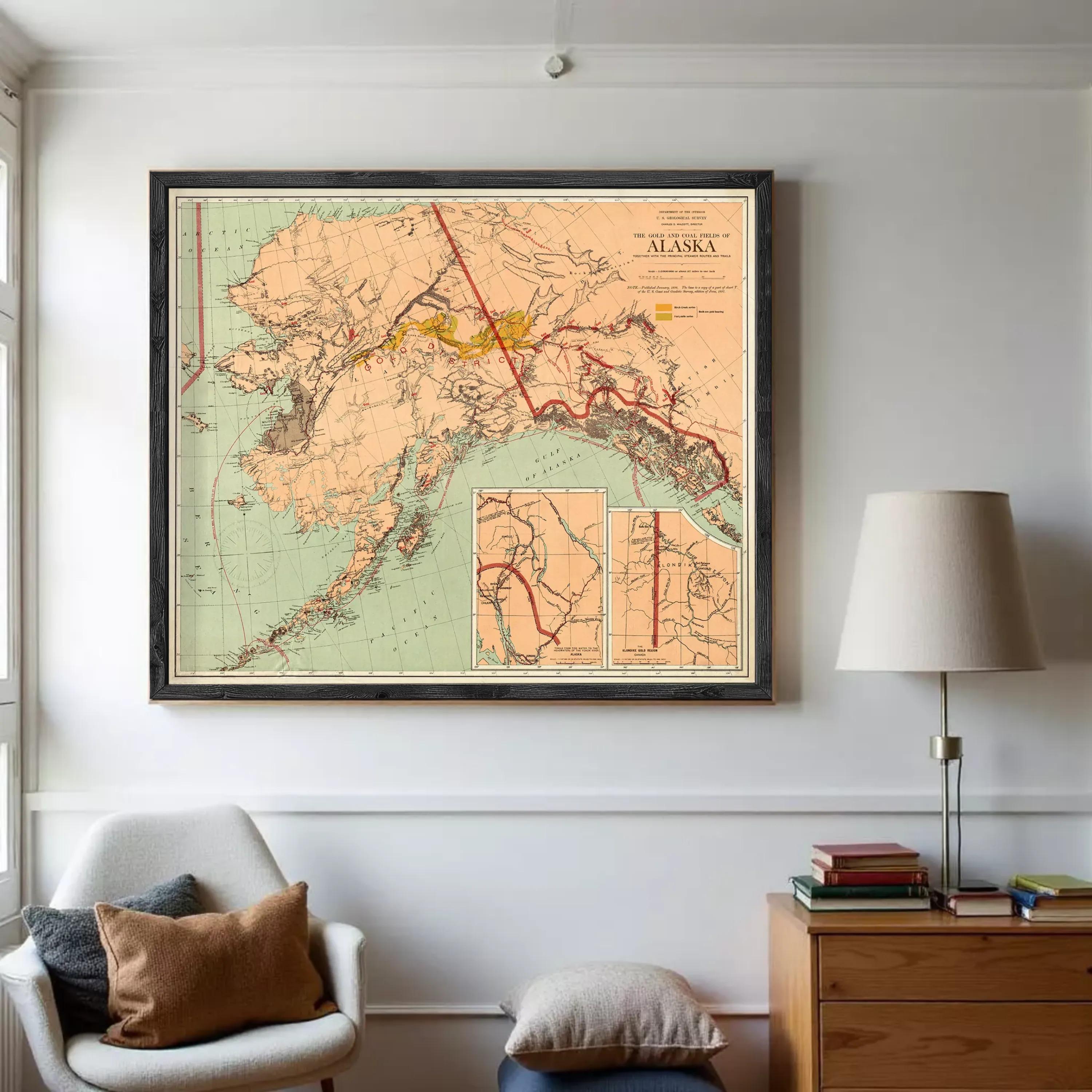 The image is a framed vintage map of Alaska, depicting the state's geographical layout and surrounding areas.