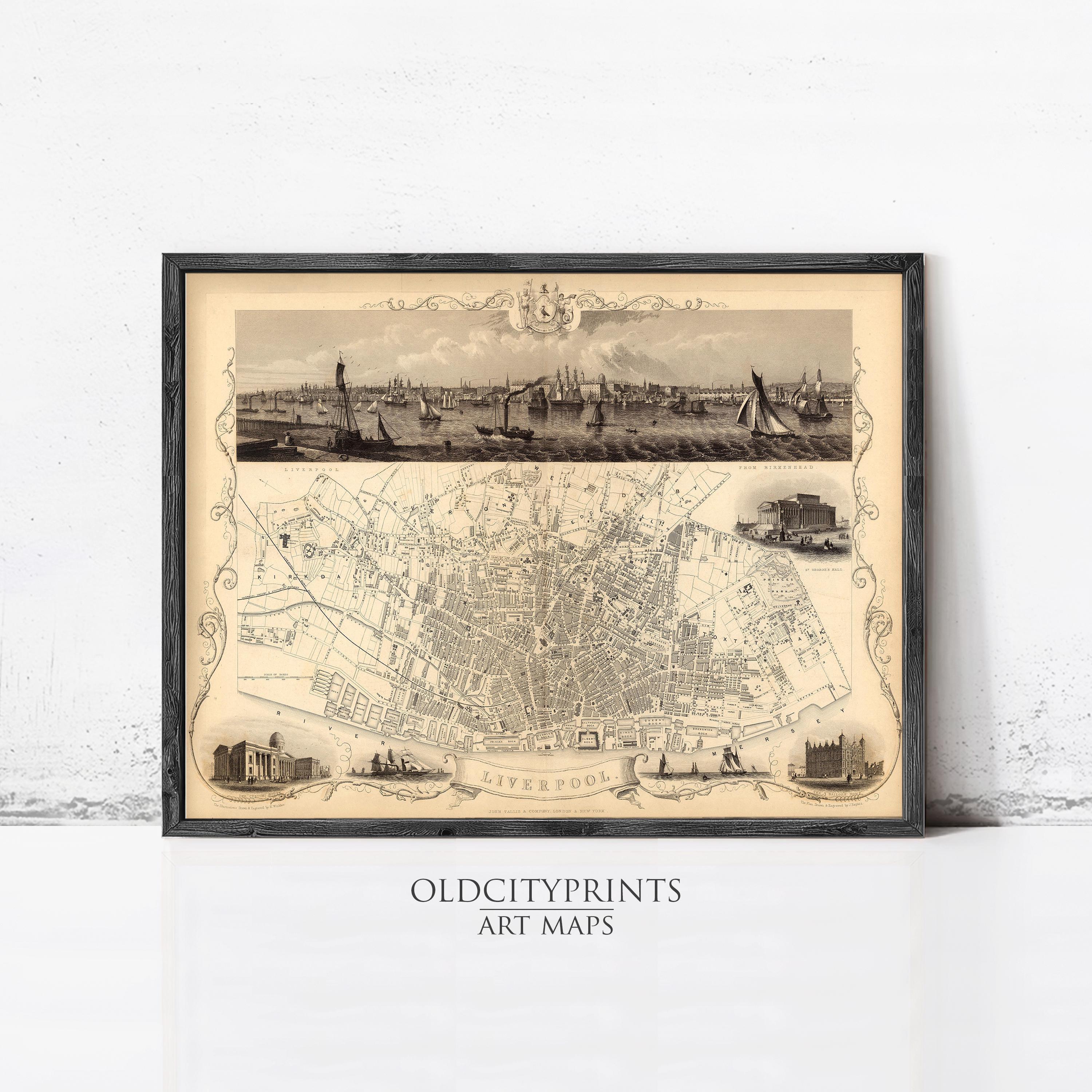 The image is a framed art print depicting a map of Liverpool, with a detailed illustration of the city's streets, landmarks, and boats.