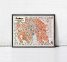 The image is a framed vintage map of Prague, Czech Republic, depicting the city's streets and landmarks in an orange and black color scheme.
