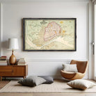 a large framed map of Canton, a city in the United States, hanging on a white wall in a living room setting.