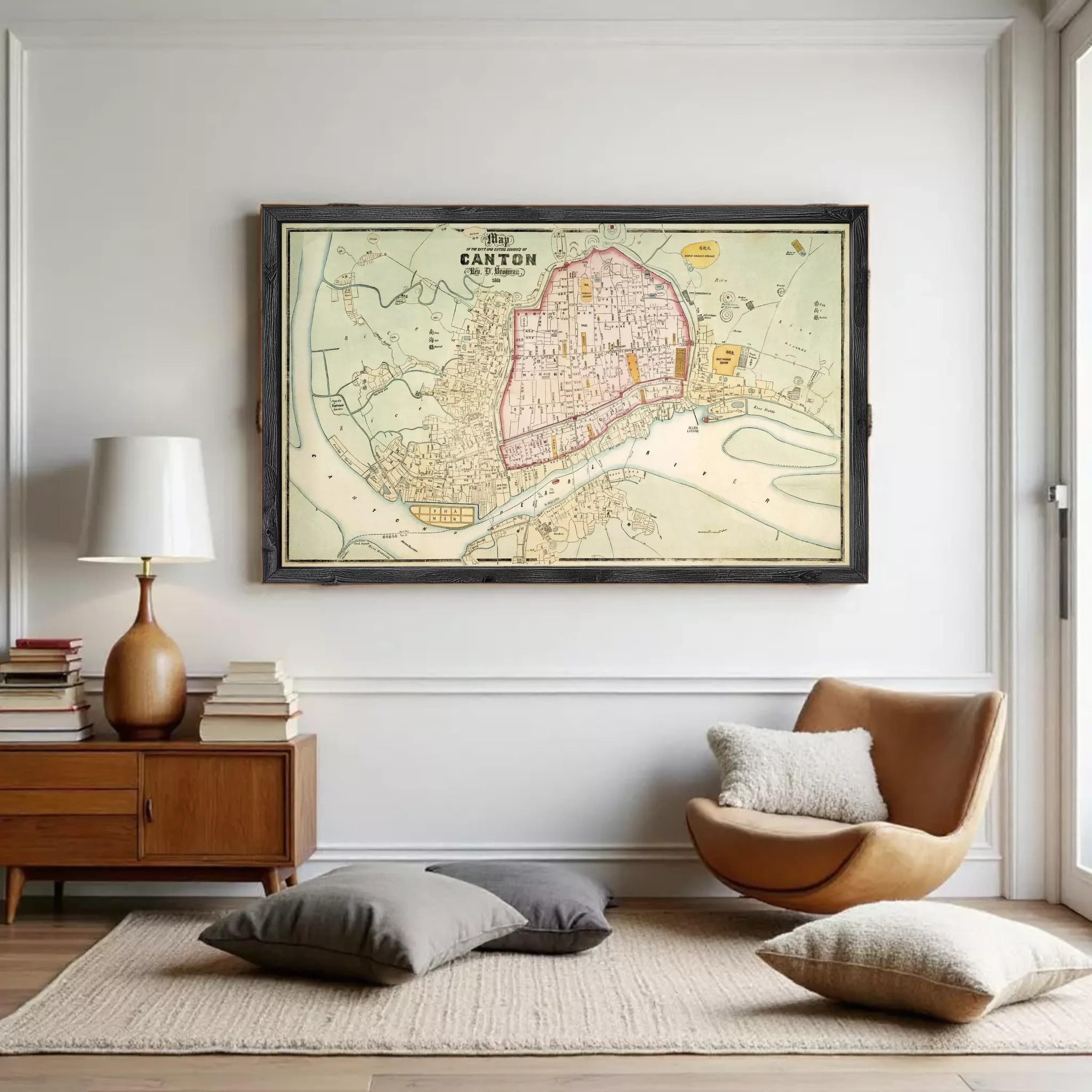 a large framed map of Canton, a city in the United States, hanging on a white wall in a living room setting.