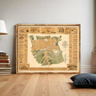 The image is a framed vintage map of a city, likely from the 19th century, with various buildings and landmarks depicted.