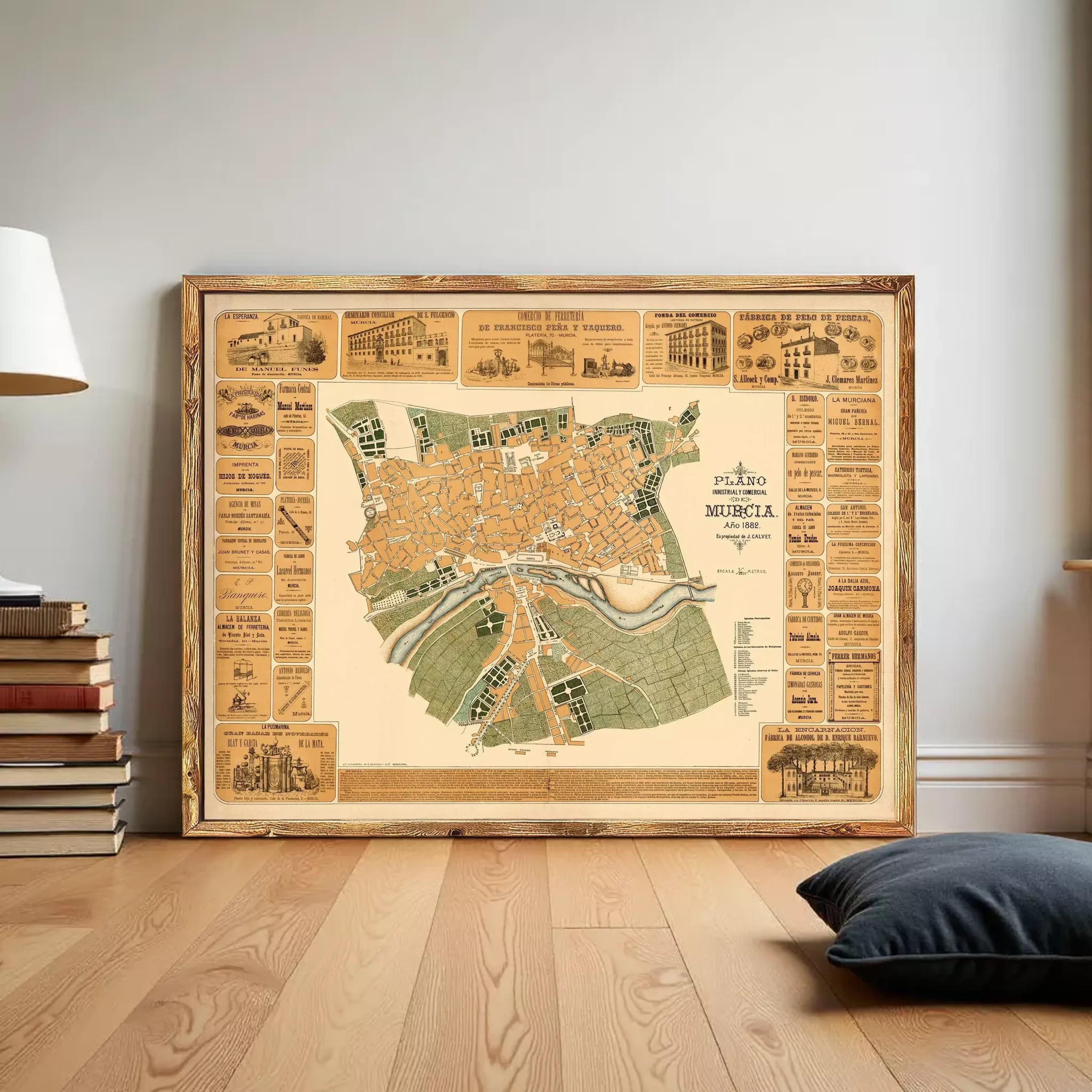The image is a framed vintage map of a city, likely from the 19th century, with various buildings and landmarks depicted.