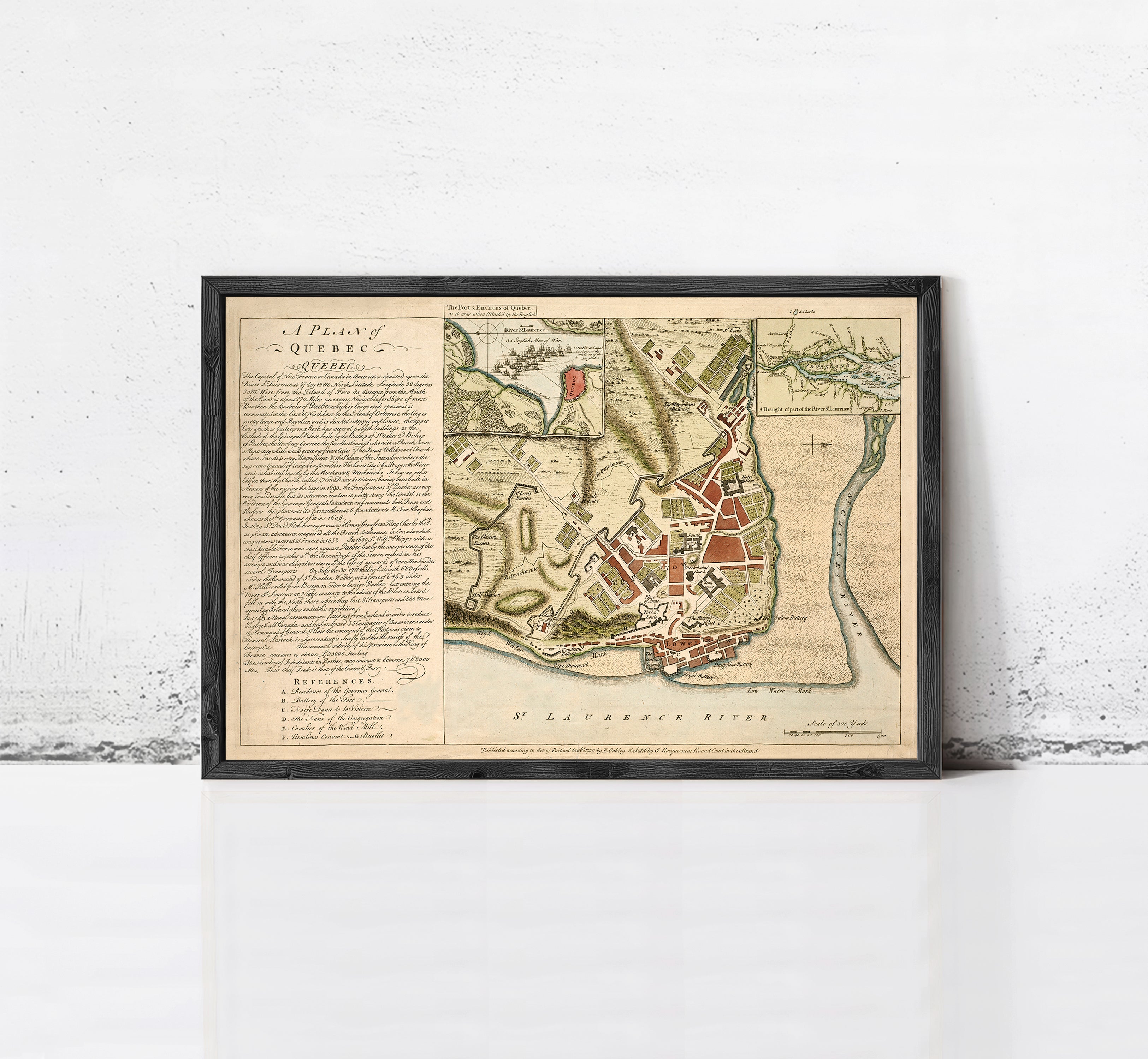 The image is a framed historical map of a city, likely from the 17th century, with detailed illustrations and labels.