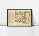 The image is a framed historical map of a city, likely from the 17th century, with detailed illustrations and labels.