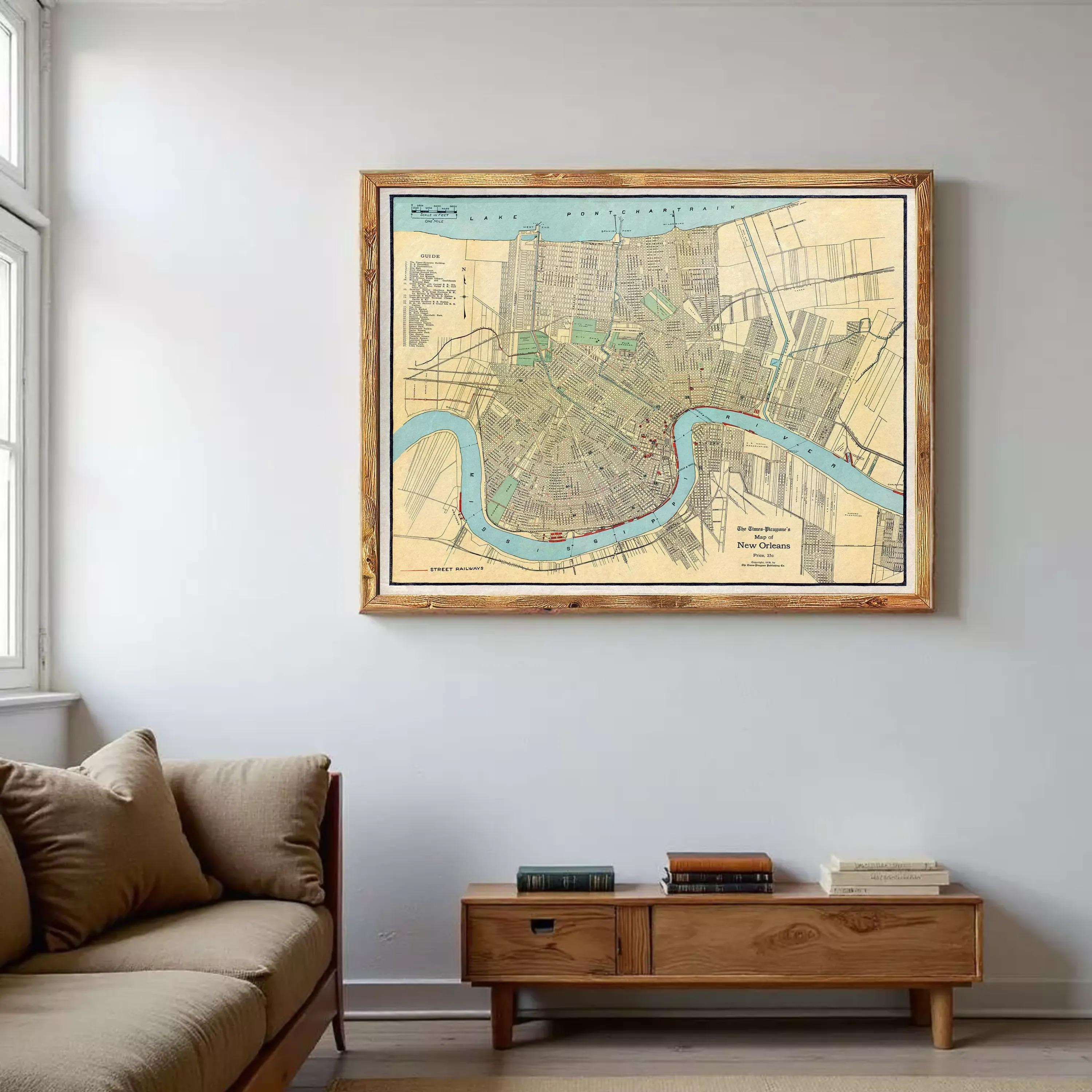 a large framed map of a city hanging on a wall in a living room.
