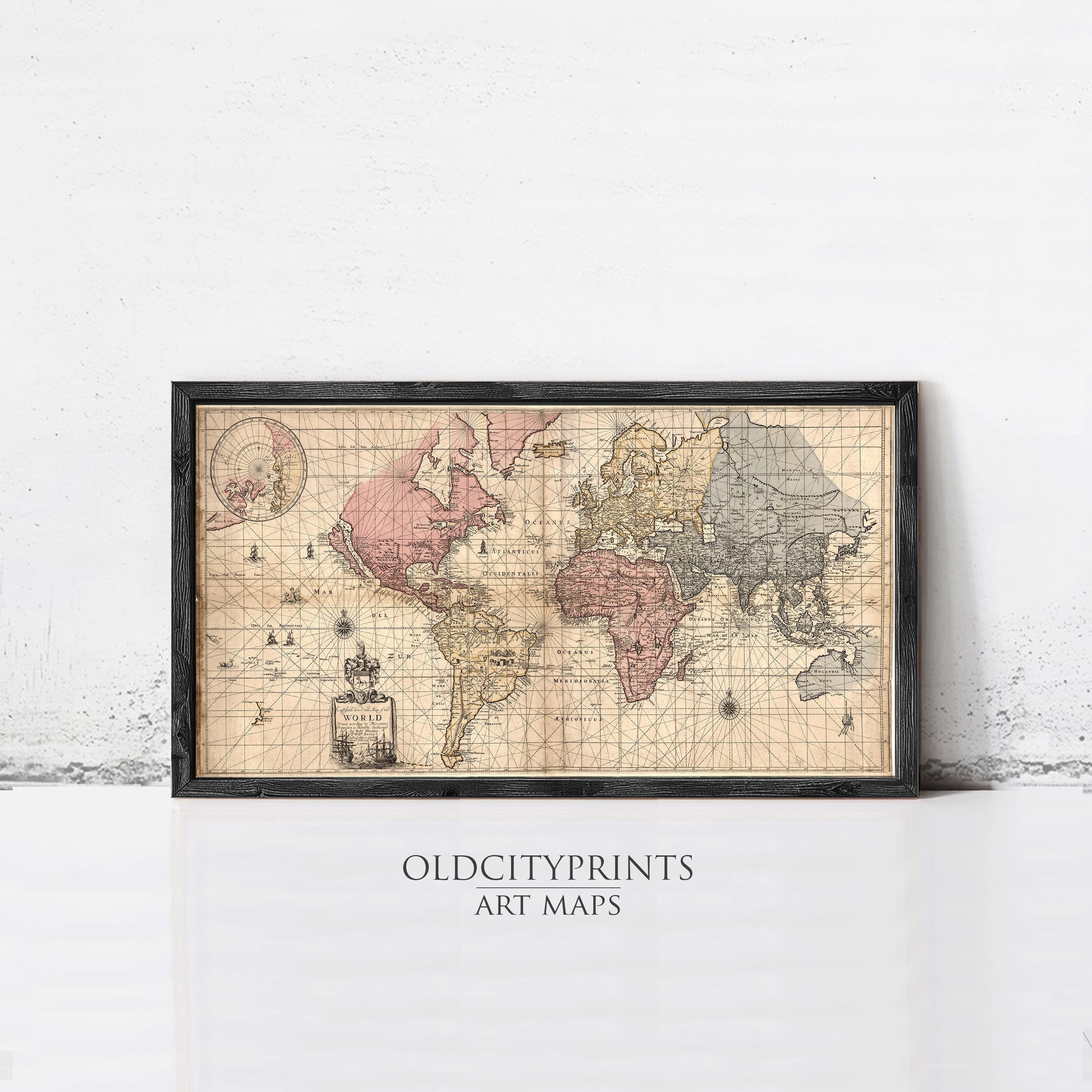 A framed vintage world map with a pink and blue color scheme, depicting the continents and oceans in a detailed and intricate manner.