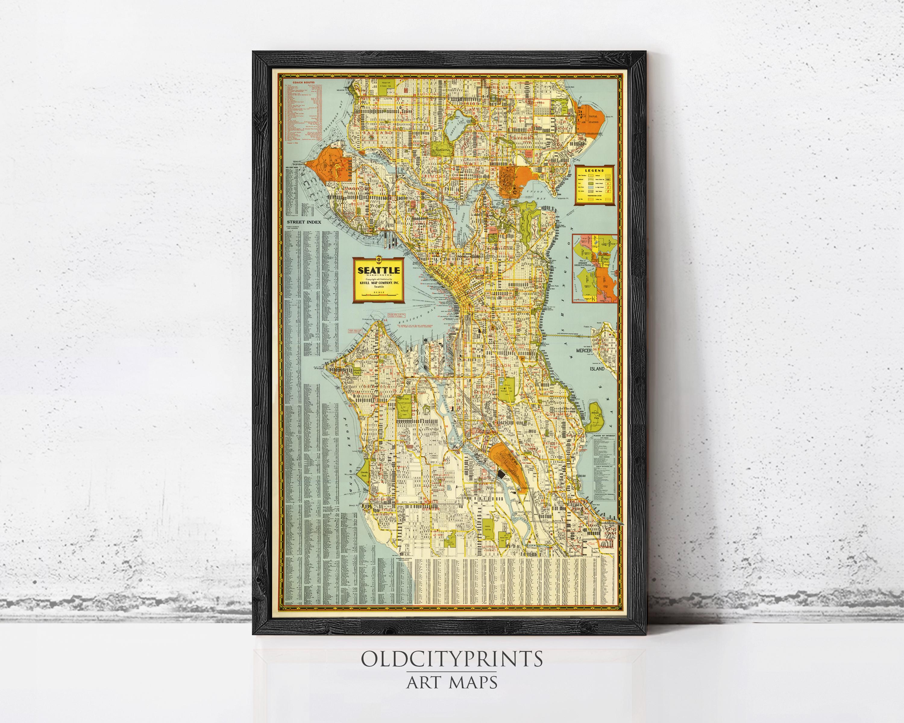 The image is a framed vintage map of Seattle, Washington, with a black border and a yellow and green color scheme.