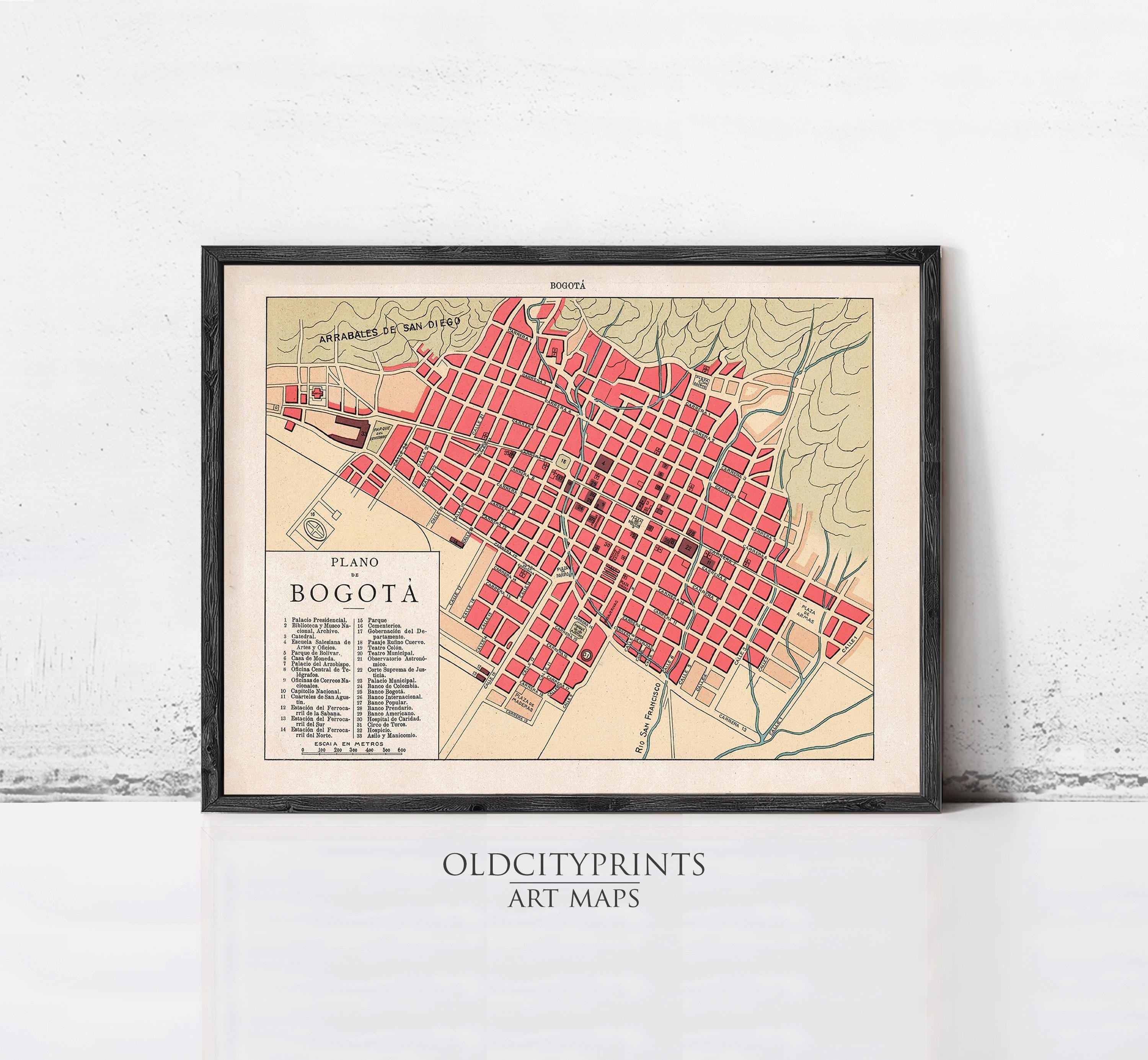 The image is a framed vintage map of Bogota, Colombia, depicting the city's layout and streets.