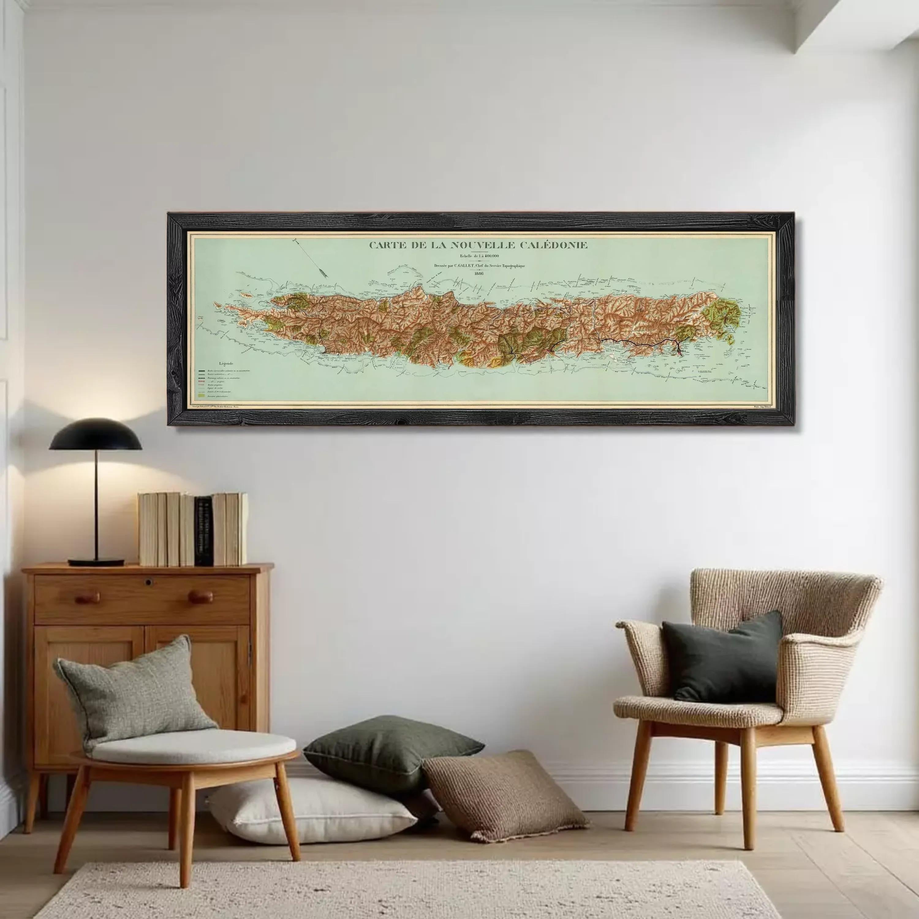 A framed map of the island of La Nouvelle Caledonie, showing the geographical layout and surrounding areas.