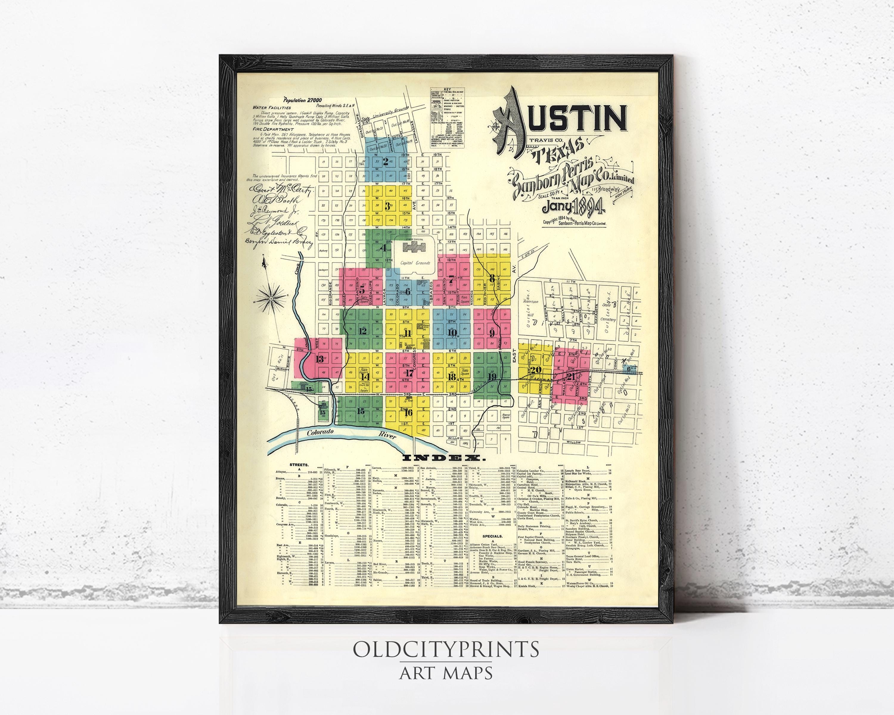 The image is a framed vintage map of Austin, Texas, depicting the city's layout and surrounding areas.