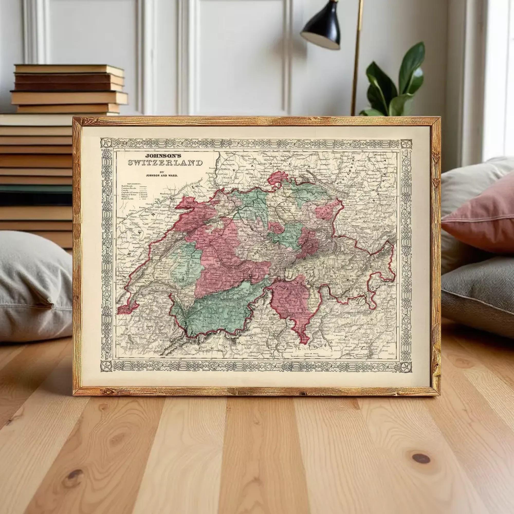 a framed map of Switzerland, with a wooden table in the foreground.