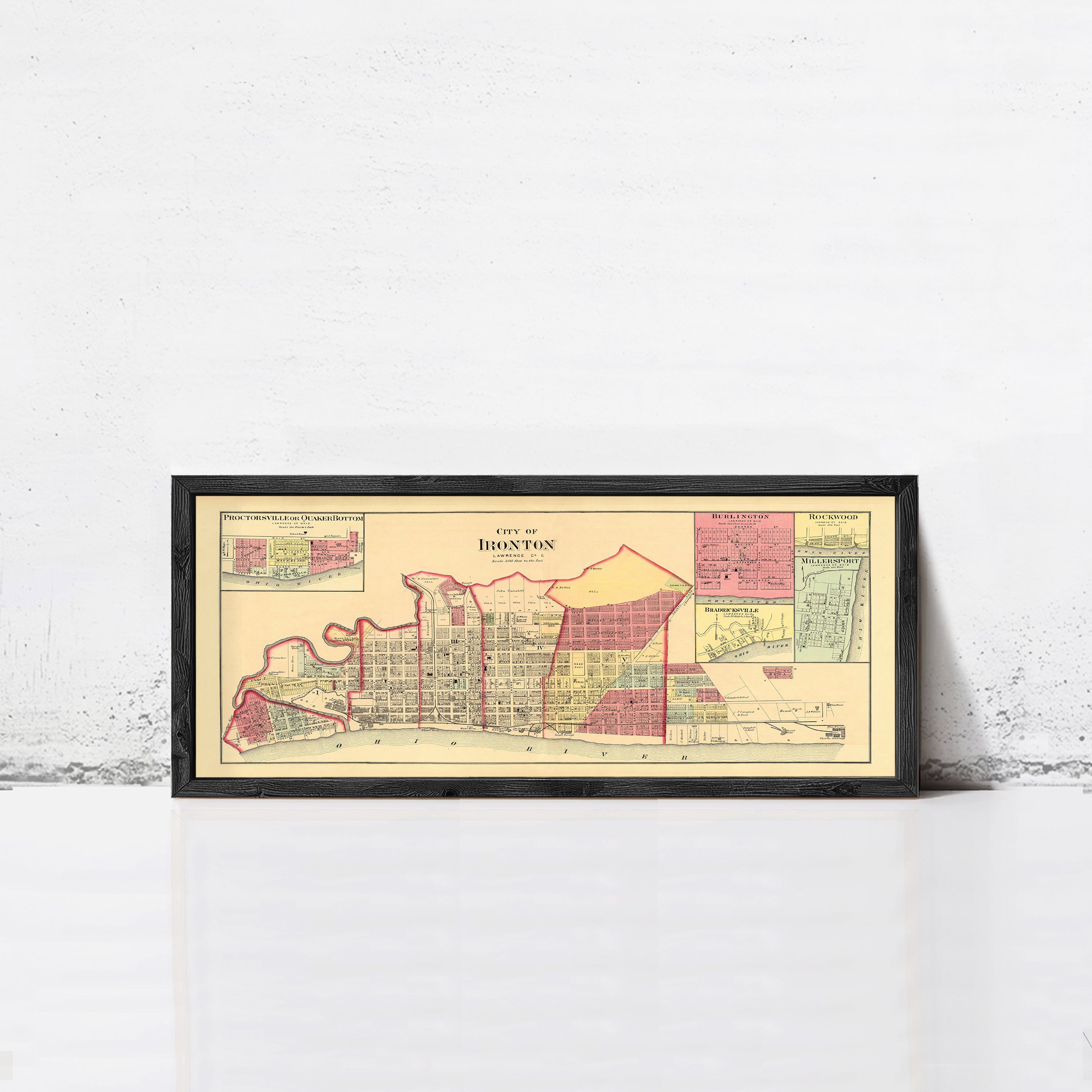 A framed map of the city of Houston, Texas, depicting the city's layout and surrounding areas.