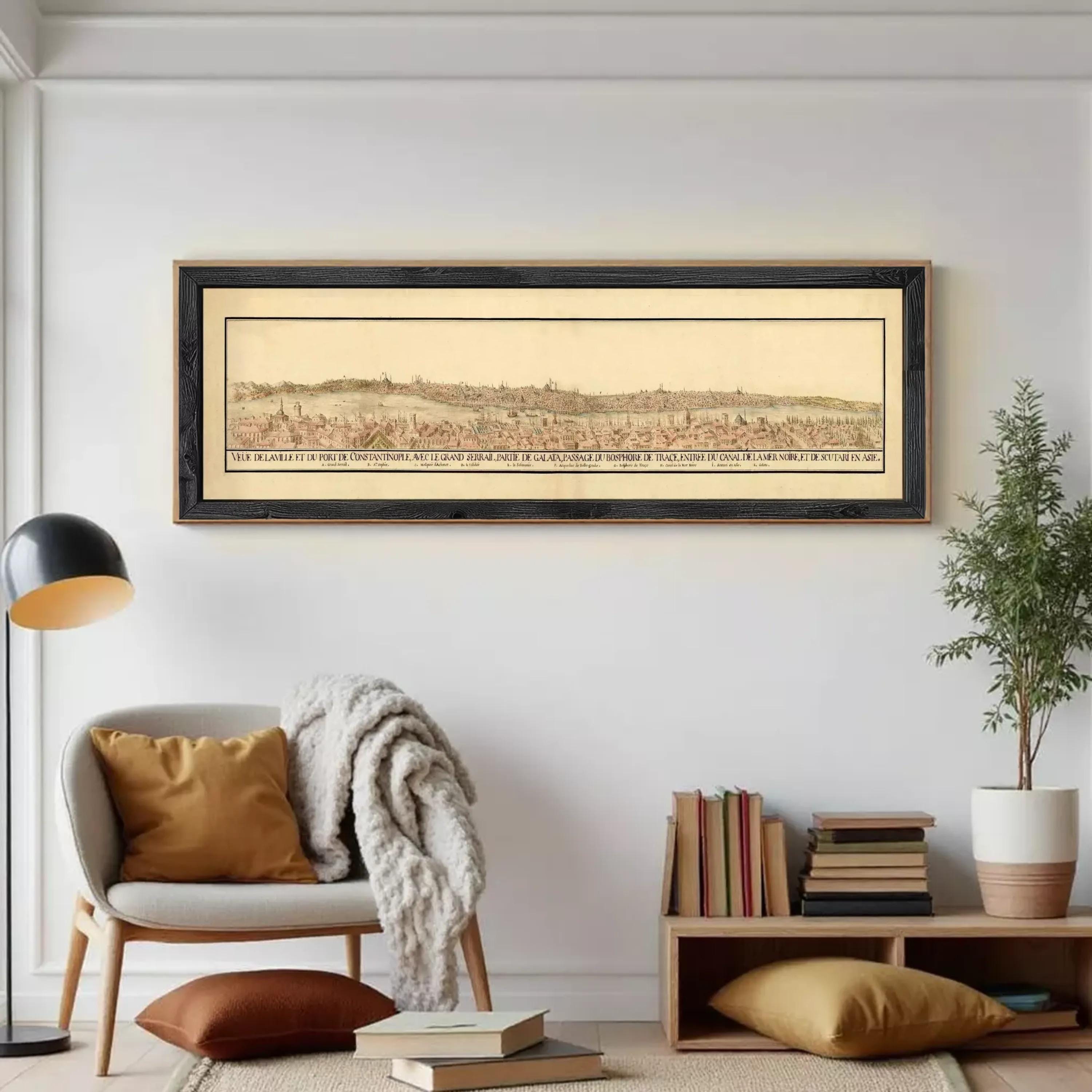 The image is a framed print of a historical map depicting a cityscape, with a white wall in the background.