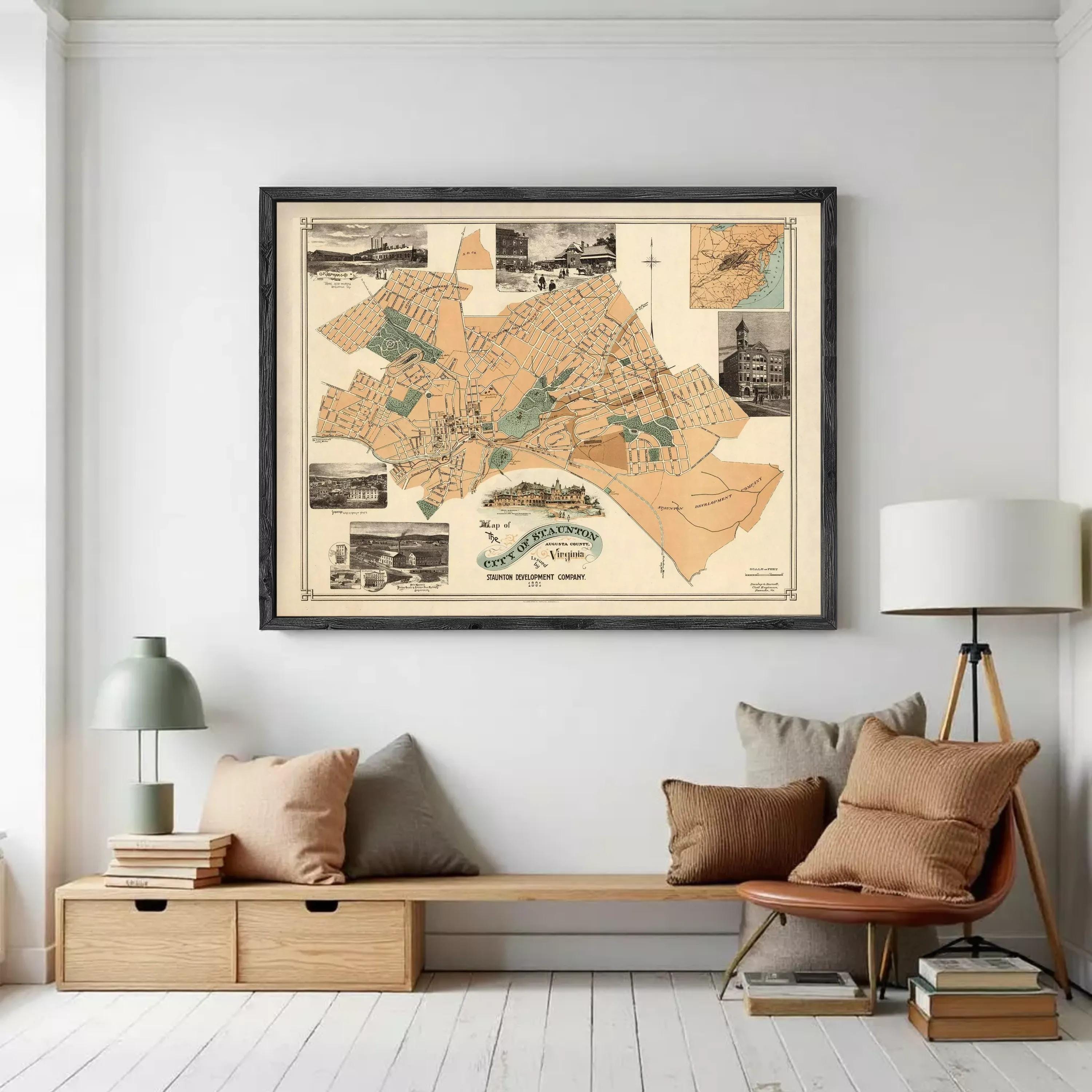 a large framed map of the city of Virginia, with various landmarks and streets depicted. The map is hanging on a wall, and there is a wooden bench and a lamp in the foreground.