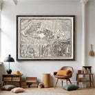 a large framed map of a city hanging on a wall in a living room.