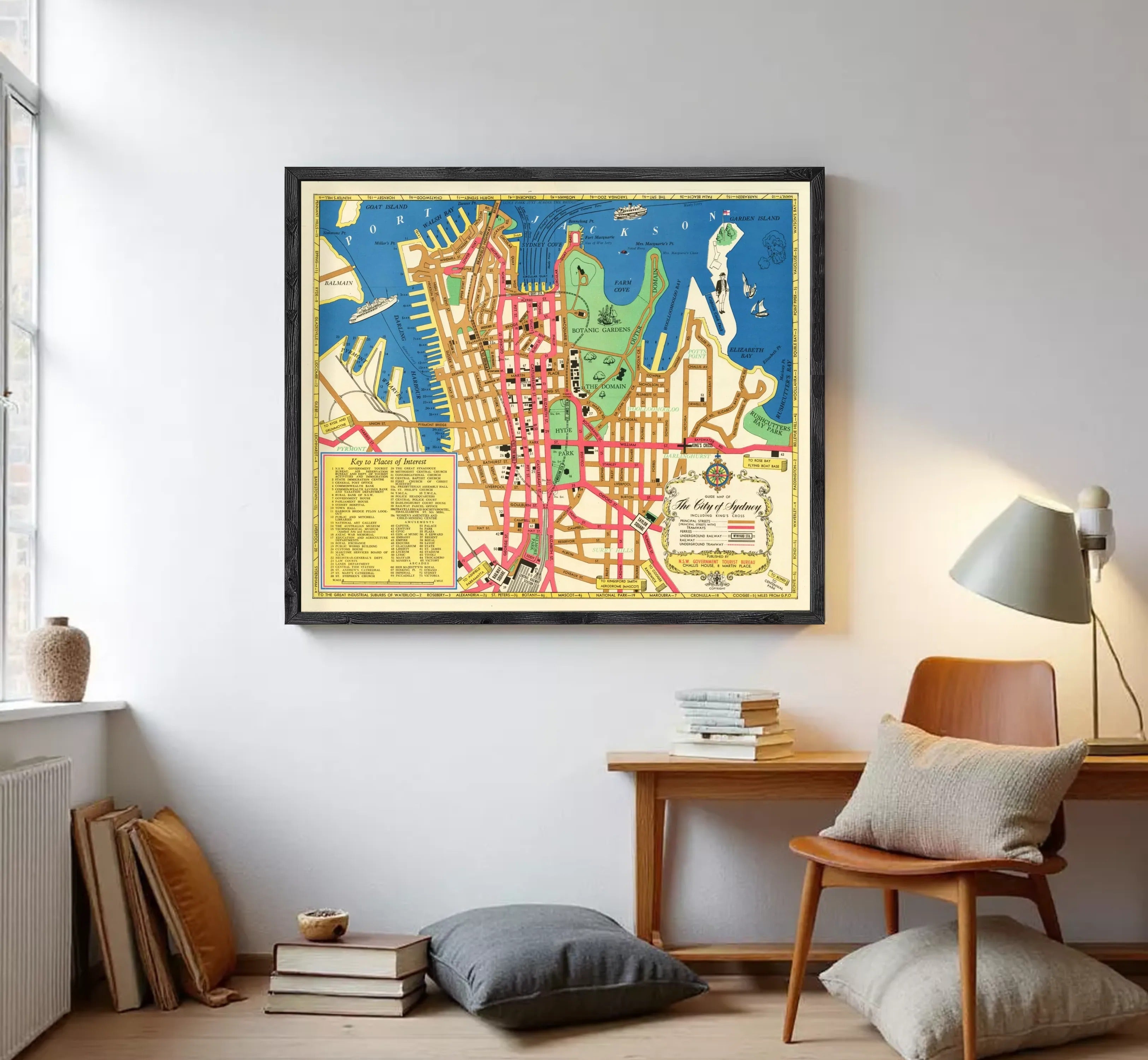 The image is a framed vintage map of a city, likely Sydney, Australia, with various landmarks and streets labeled.