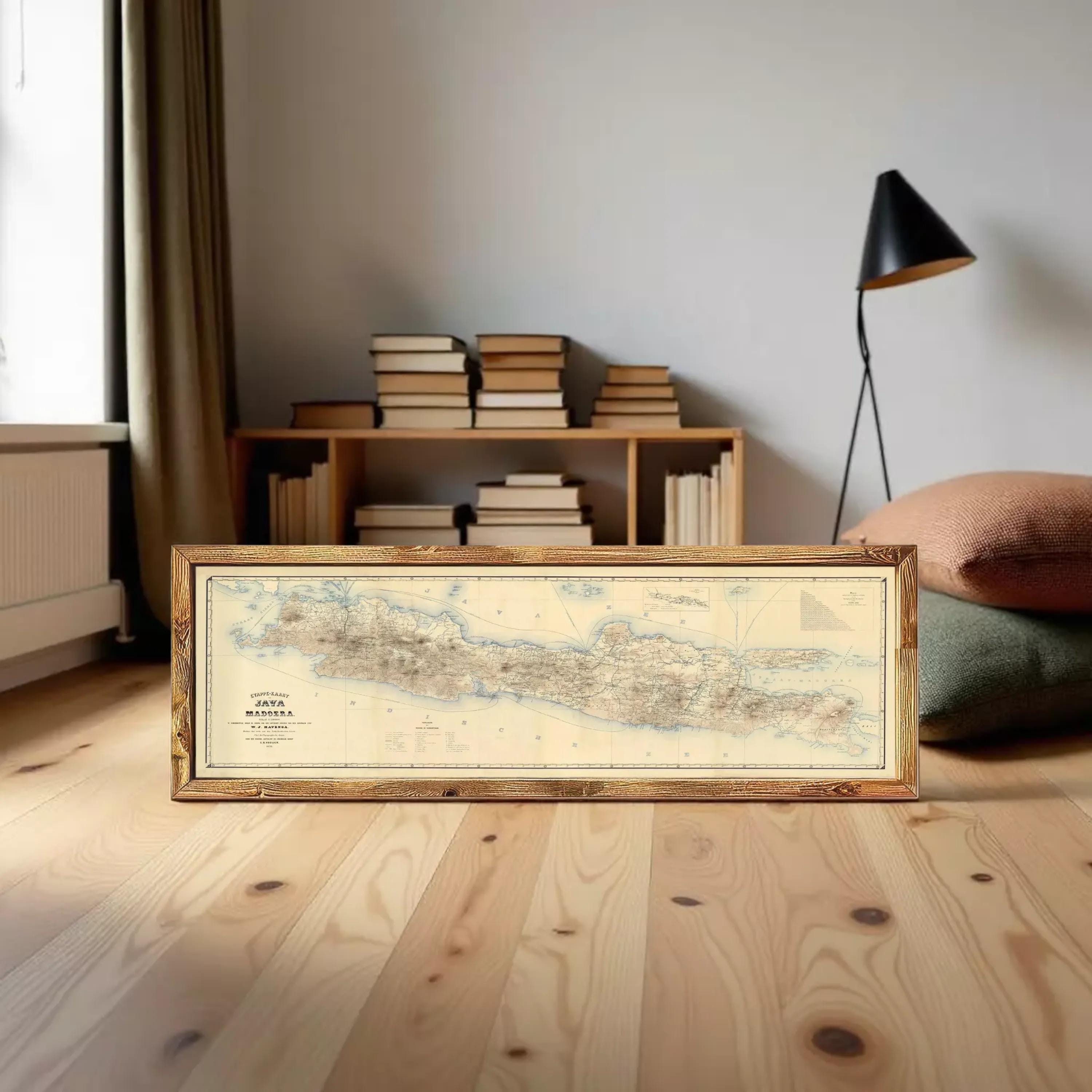 A framed map of Madagascar, a country in the South Pacific, is displayed against a white wall.