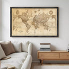 a large world map hanging on a wall above a couch in a living room setting.