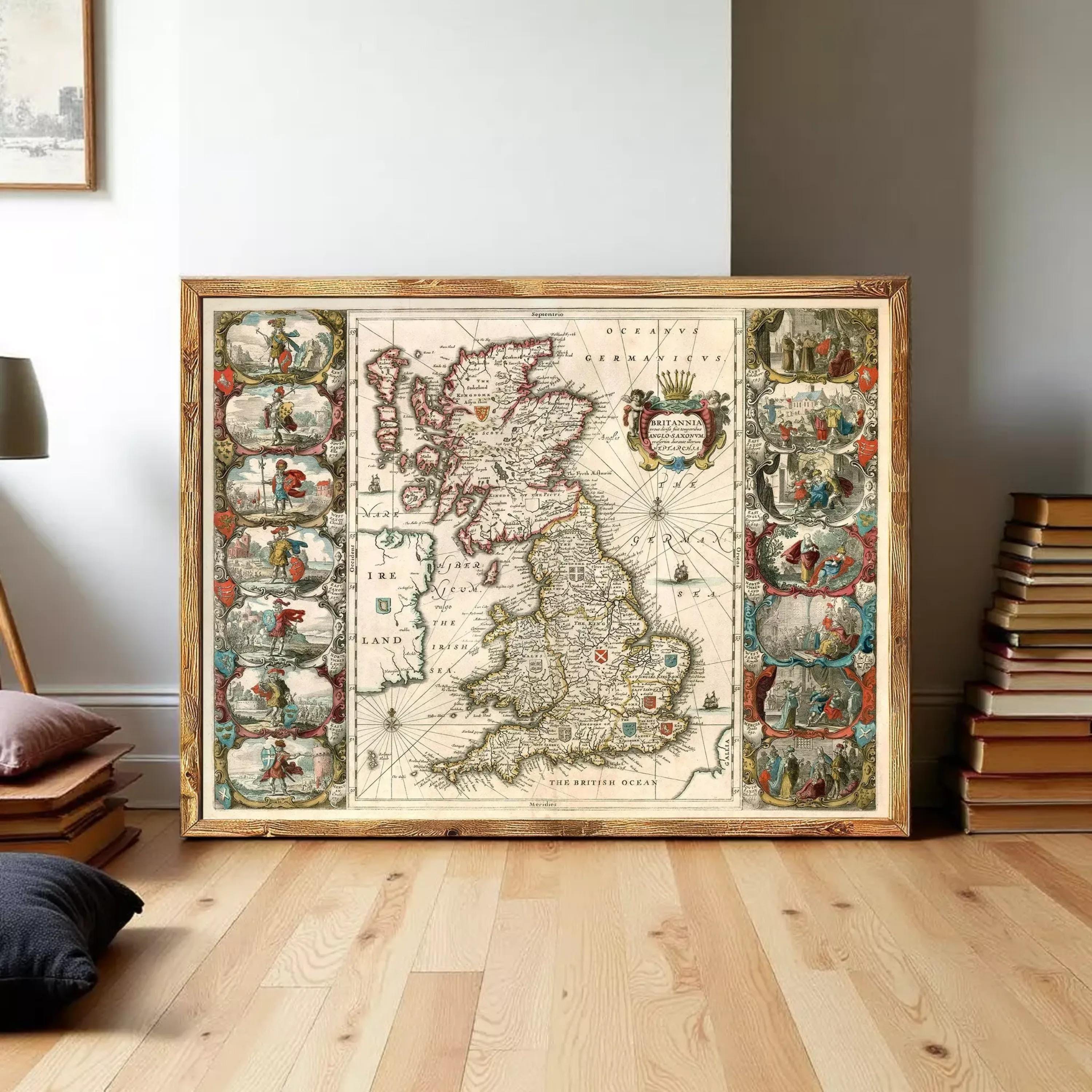 A large framed map of the United Kingdom, featuring intricate illustrations and details, is displayed on a wooden floor in a room with books and other decor.