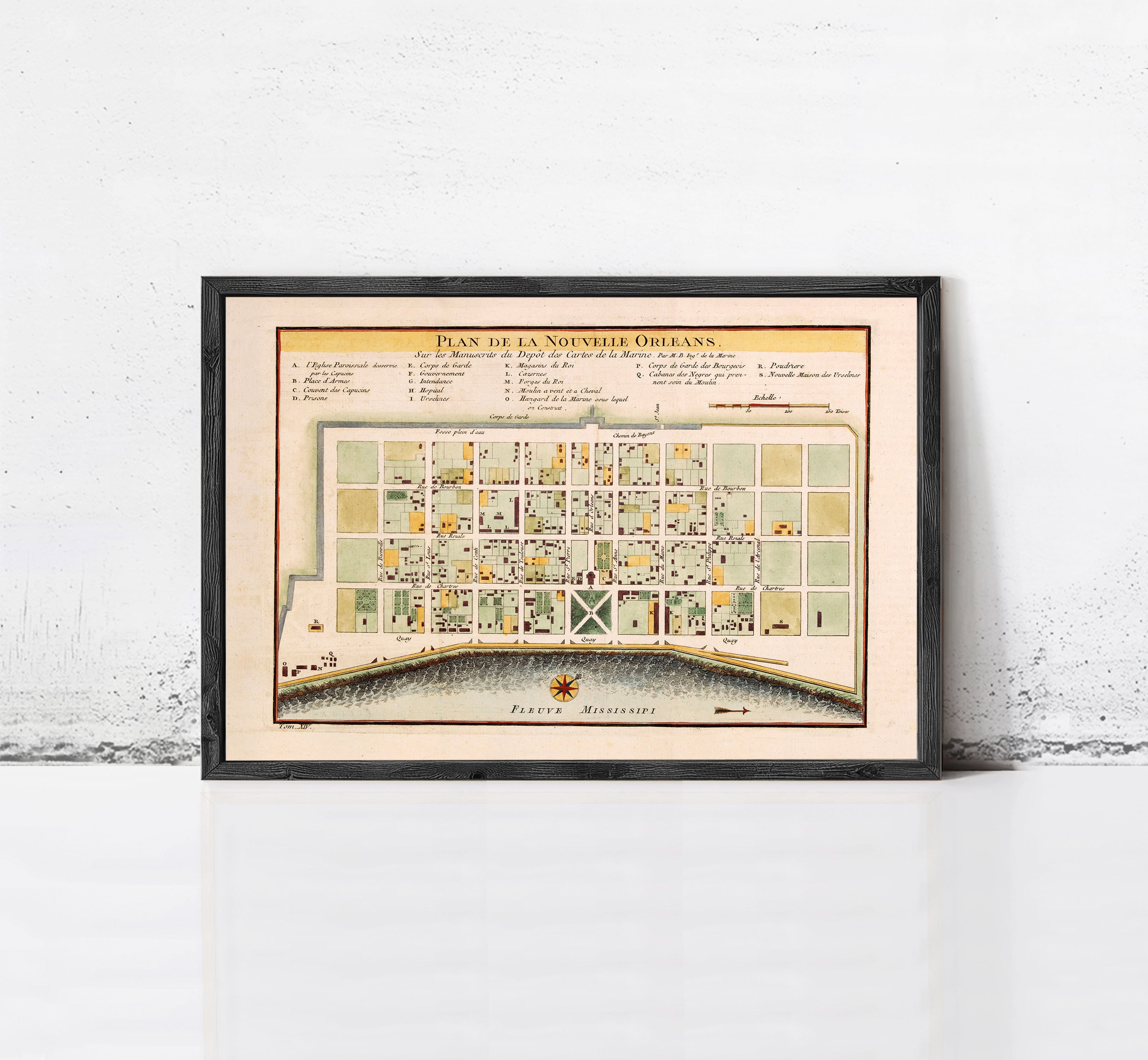 The image is a framed vintage map of the city of New Orleans, Louisiana, with a detailed layout of the city's streets and buildings.