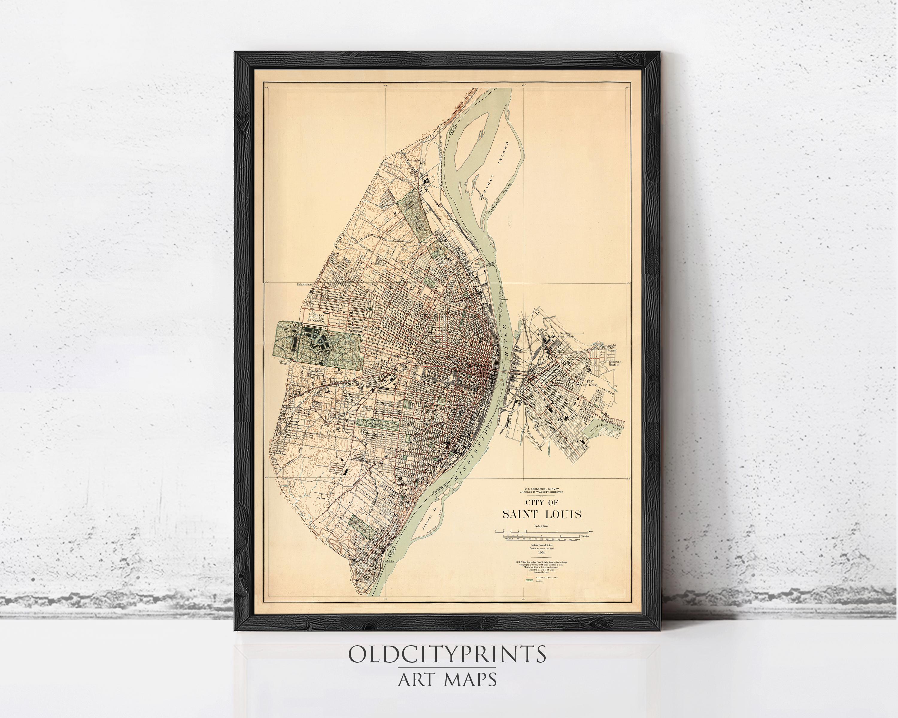 The image is a framed vintage map of Saint Louis, Missouri, depicting the city's layout and surrounding areas.