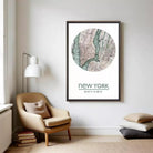 a framed map of New York City hanging on a wall in a living room.