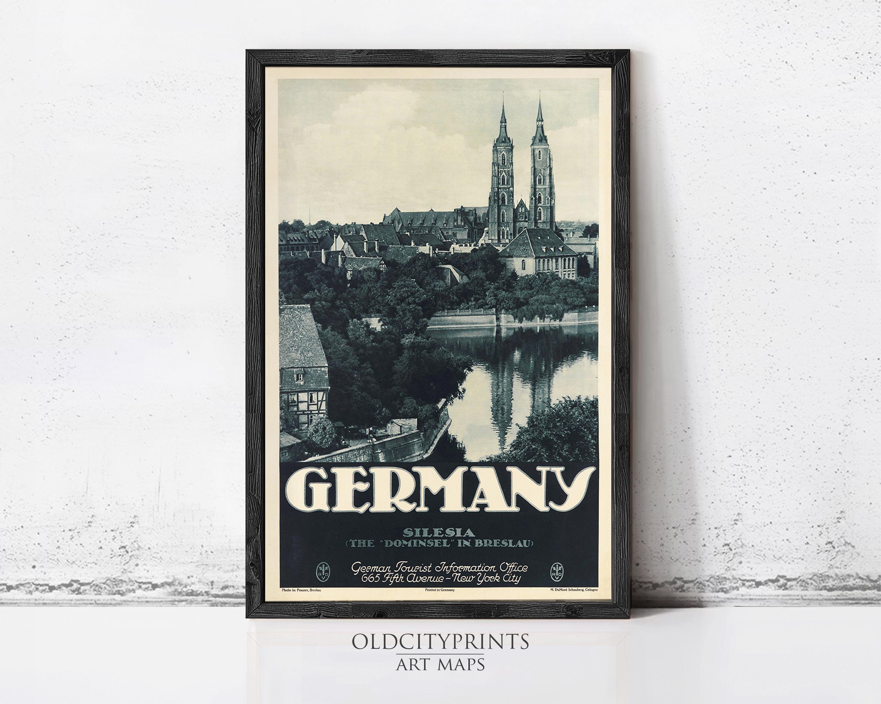 A framed vintage travel poster depicting the city of Silesia, Germany, with the city's iconic landmarks such as St. Peter's Basilica and the Old Town Hall visible.