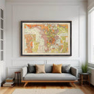 The image is a framed vintage map of a city, depicting various streets, landmarks, and geographical features.