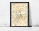 The image is a framed map of the City of Sydney, Australia, depicting the city's streets, landmarks, and surrounding areas.