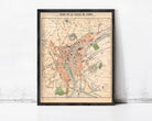 The image is a framed vintage map of a city, depicting various landmarks and streets.