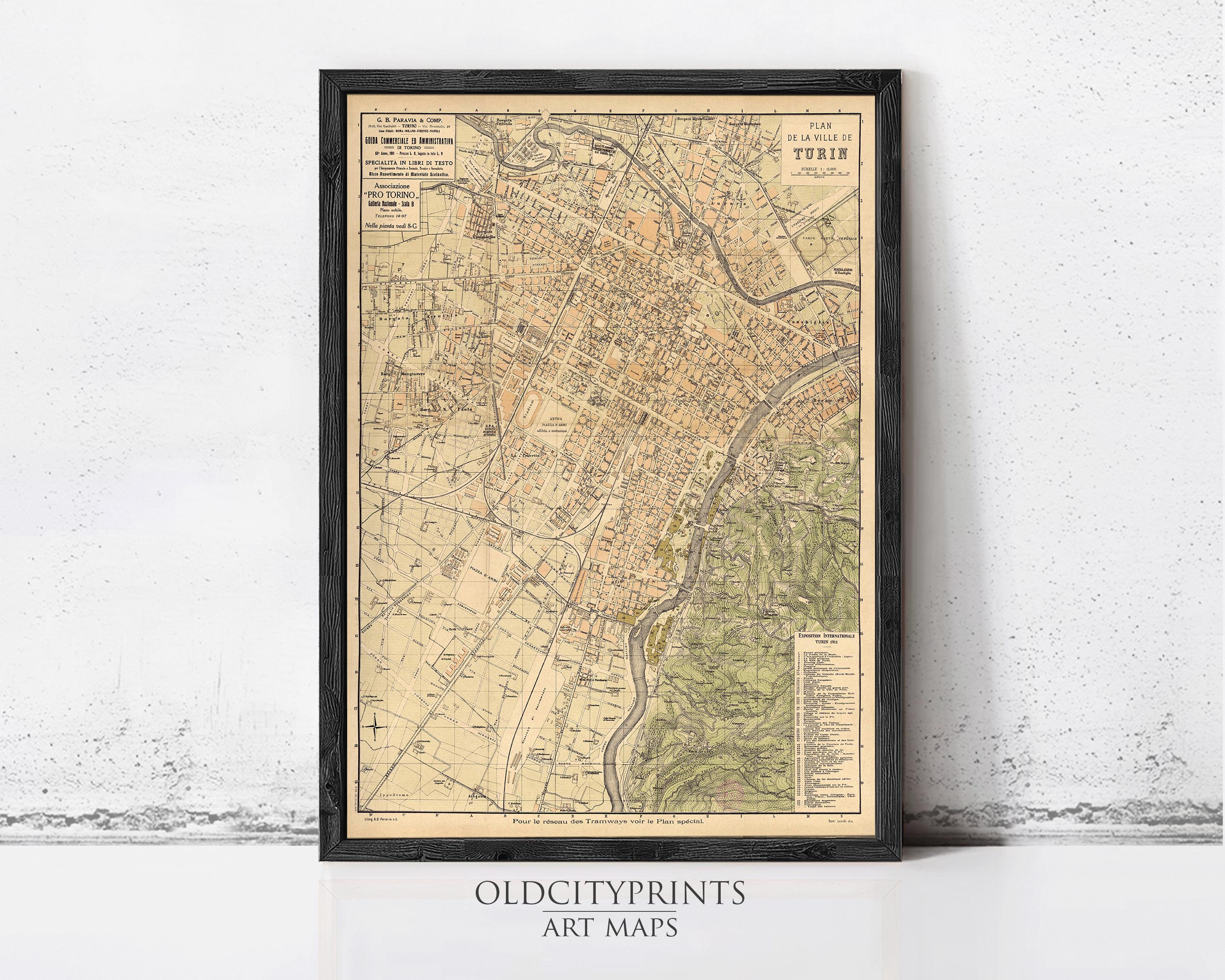 The image is a framed vintage map of a city, likely Paris, with detailed street and geographical information.